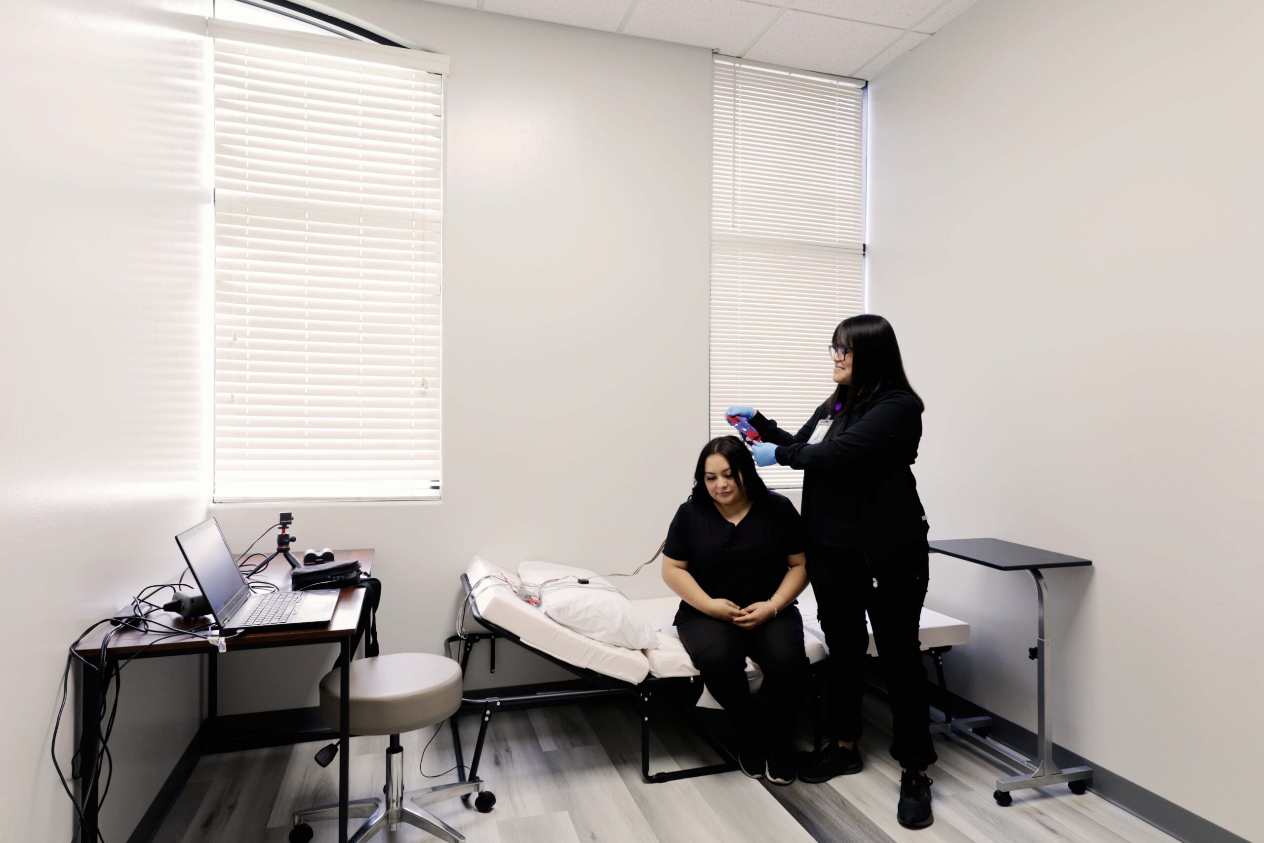 Valley Neurology Group team preparing a seated person for neurological testing